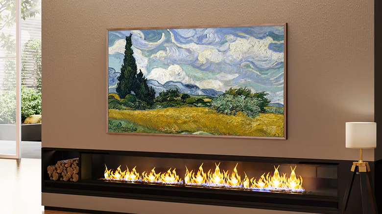 Hisense CanvasTV mounted on a living room wall above a fireplace