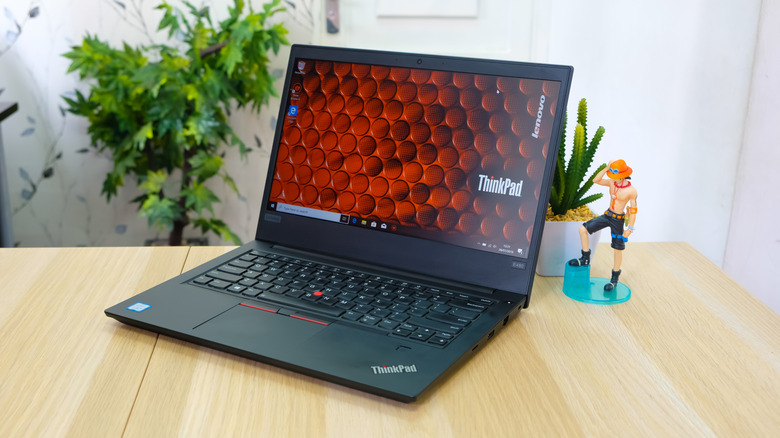 A Lenovo ThinkPad laptop on a table.