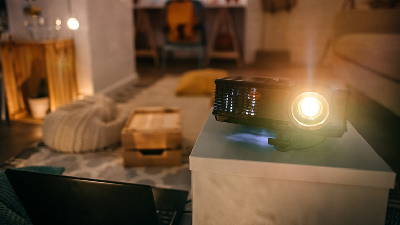 Projector running in a dimly lit room.