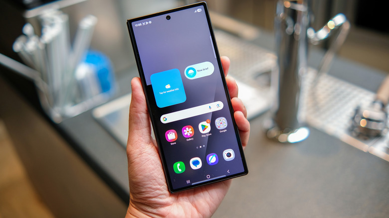 Person holding a Samsung Galaxy Z-Fold phone.