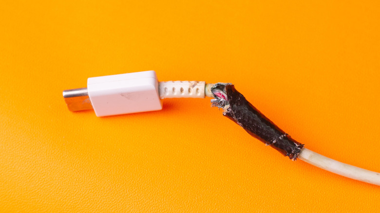 A damaged and frayed USB-C cable.