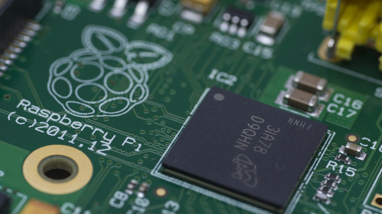 Close up of the Raspberry Pi logo on a board.