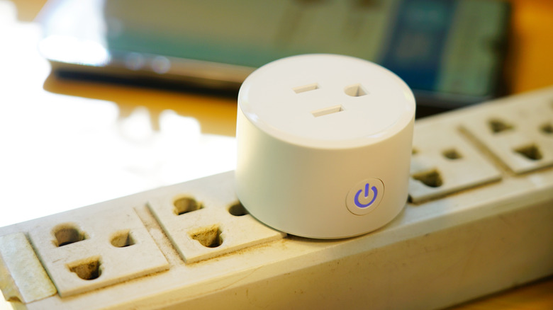 Close-up of a smart plug on a surge protector