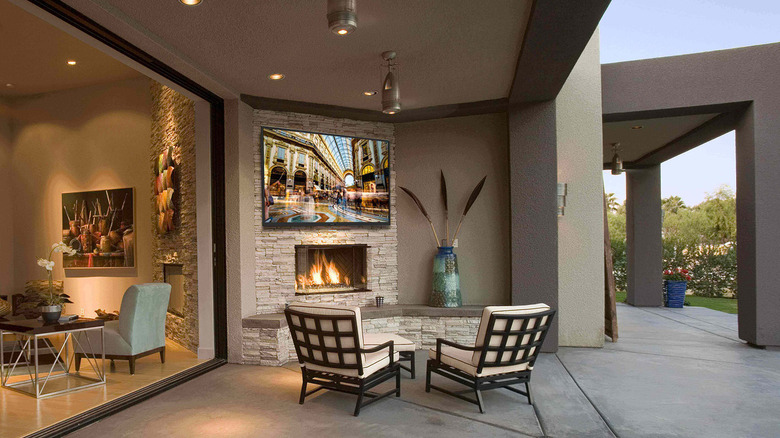 A Sunbrite outdoor TV mounted on an outdoor patio.