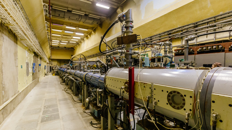 particle accelerator tubes, various piles and wires jutting out of the pipe