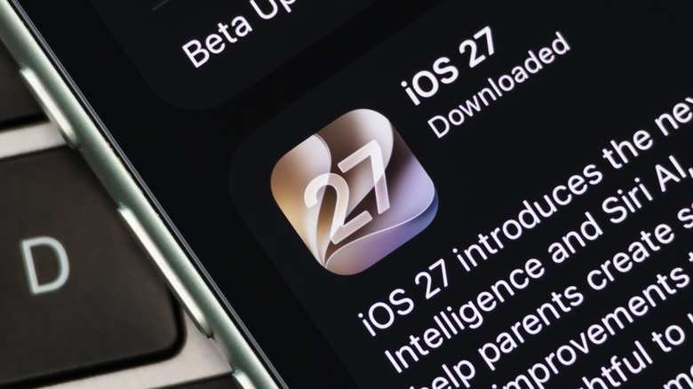 An extreme closeup of an iPhone of some sort displaying that the phone has downloaded the iOS 27 update