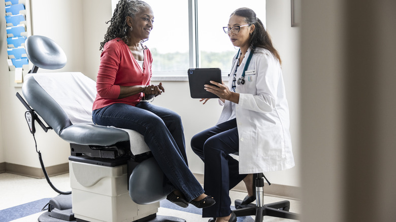a doctor consults with a patient