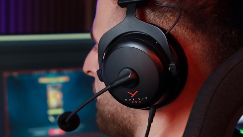 Beyerdynamic MMX 300 Pro headset close up worn on someone playing games.