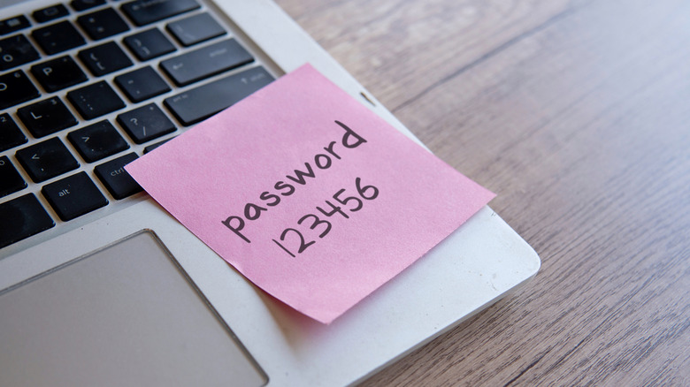sticky note with easy password on laptop
