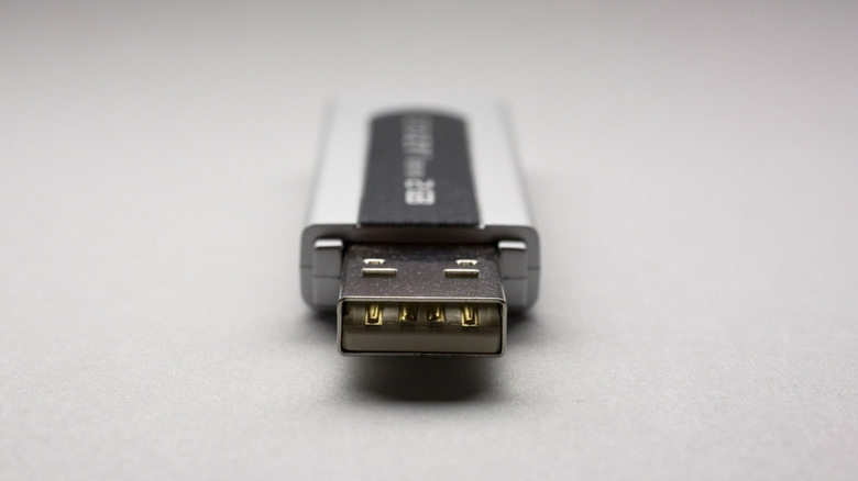 A USB flash drive with its port pointed straight to camera.