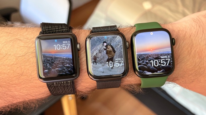 Three Apple Watches on a man's arm