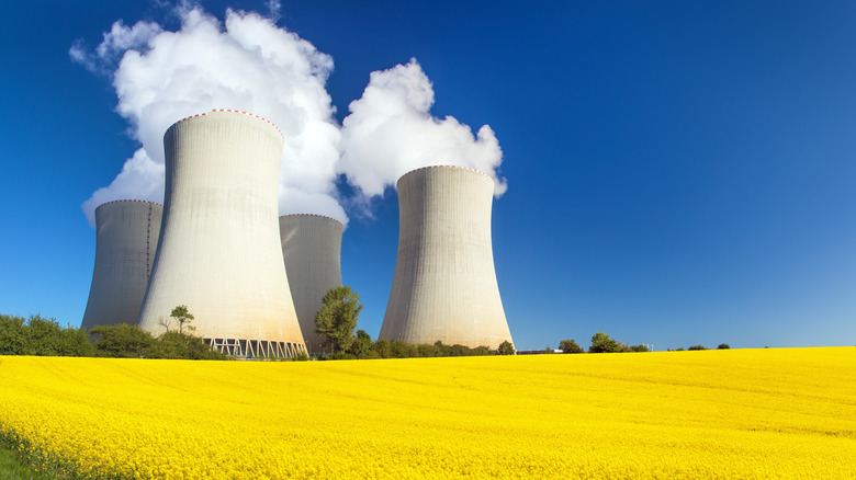 An active nuclear power plant next to a field.