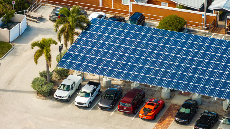 Solar panels installed over a parking lot.