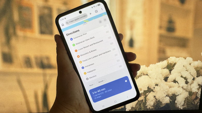 Phone showing Apple Maps with 13 stops