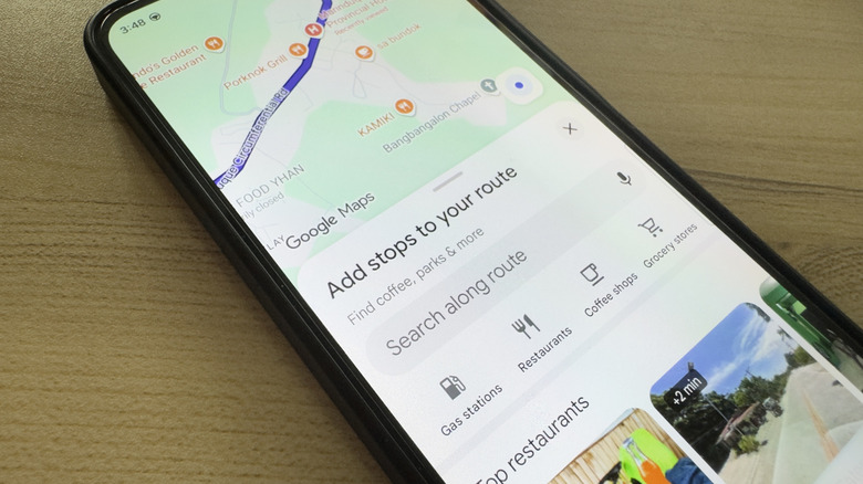 Phone showing Google Maps adding stops to route