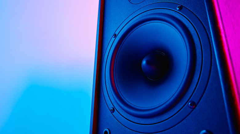 a subwoofer lit in purple and blue lights