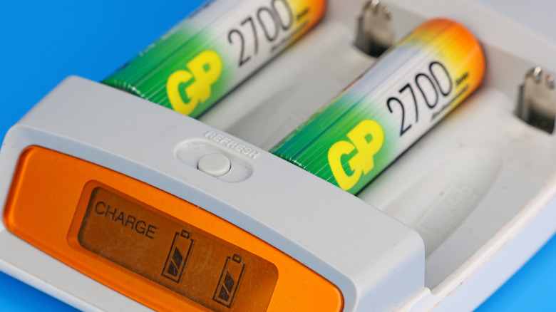 A charger containing multiple rechargeable lithium-ion batteries
