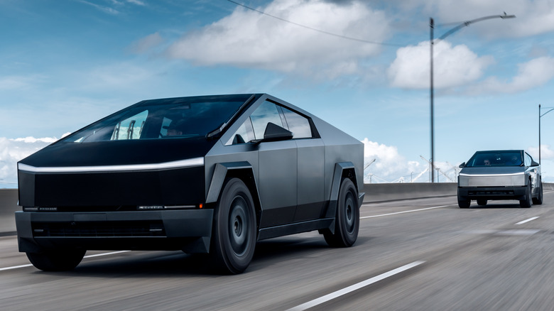 Two Tesla Cybertrucks driving on the highway