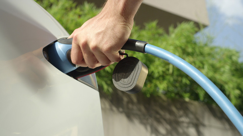 Electric car plugged in to recharge.