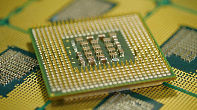 a close up showing a CPU with gold plated pins
