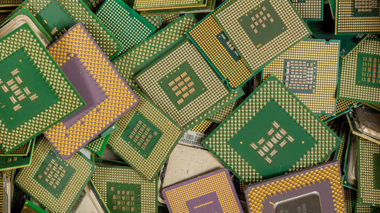 a collection of CPUs showing gold plated pins for recycling
