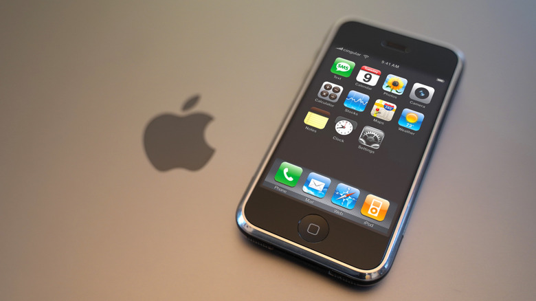 The original iPhone on top of a MacBook.