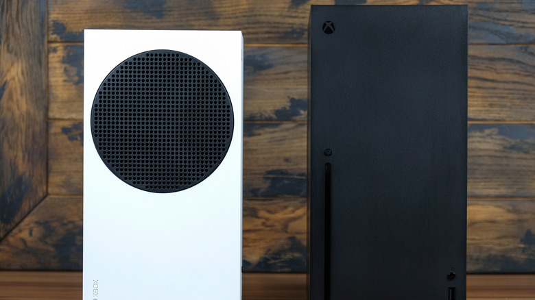 A white Xbox Series S next to a black Xbox Series X