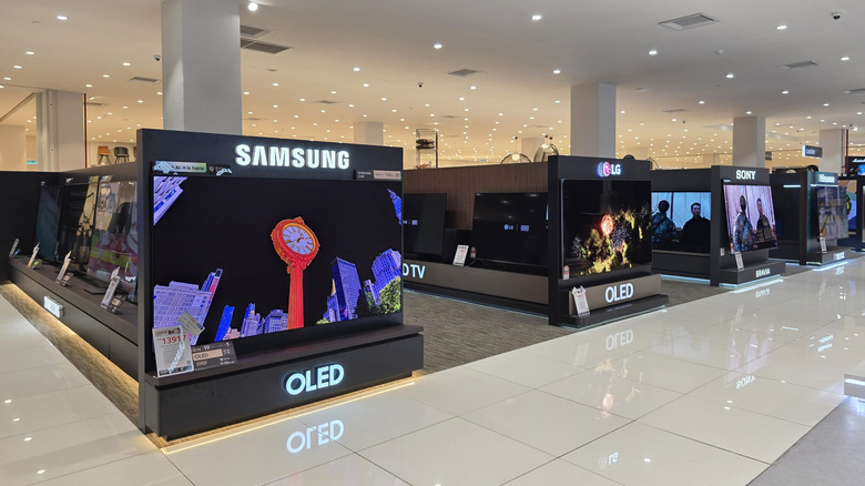 A retail outlet showcasing Samsung, LG, and Sony TVs.
