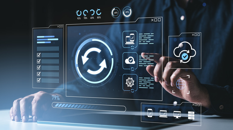 Concept image showing a person interacting with a virtual interface for data sync and backup