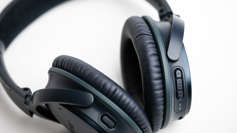 Black Bose headphones on a white background.