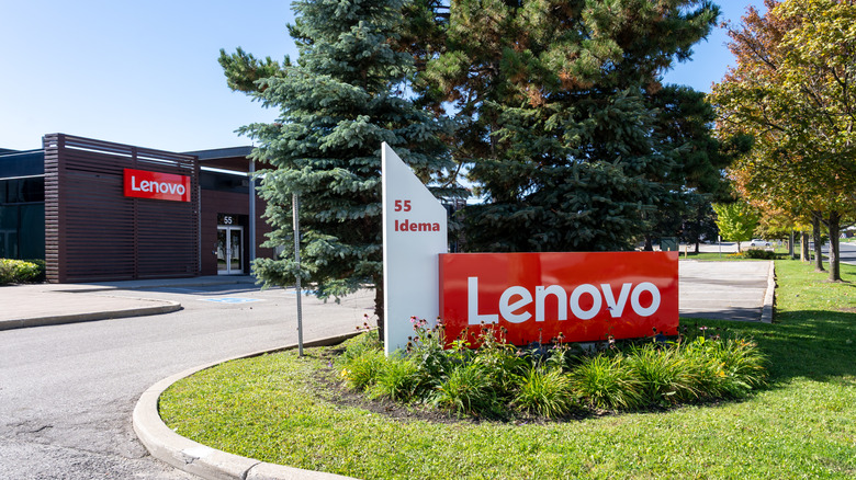 The Lenovo logo in front of an office