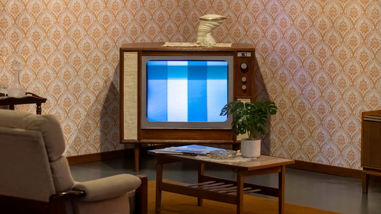 A console television in a retro 1970s living room