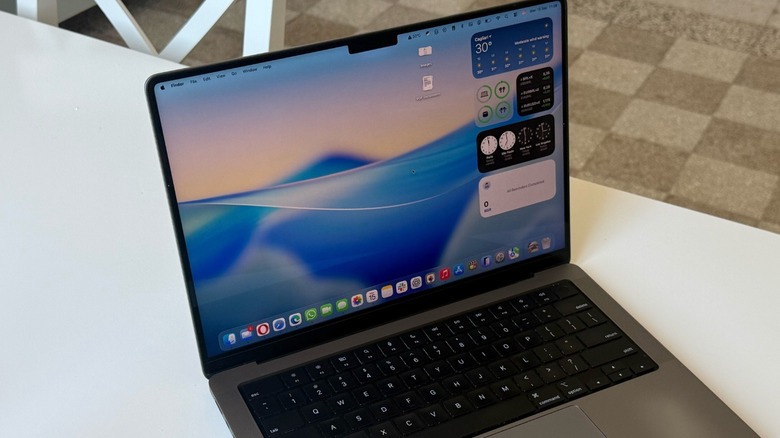 A MacBook Pro on a white table