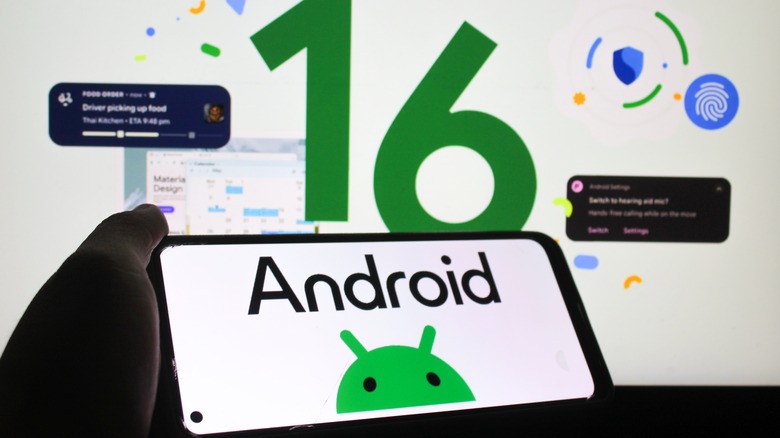 An individual holding a smartphone in their left hand, displaying the Google Android Logo, a graphic for Android 16 in the backdrop