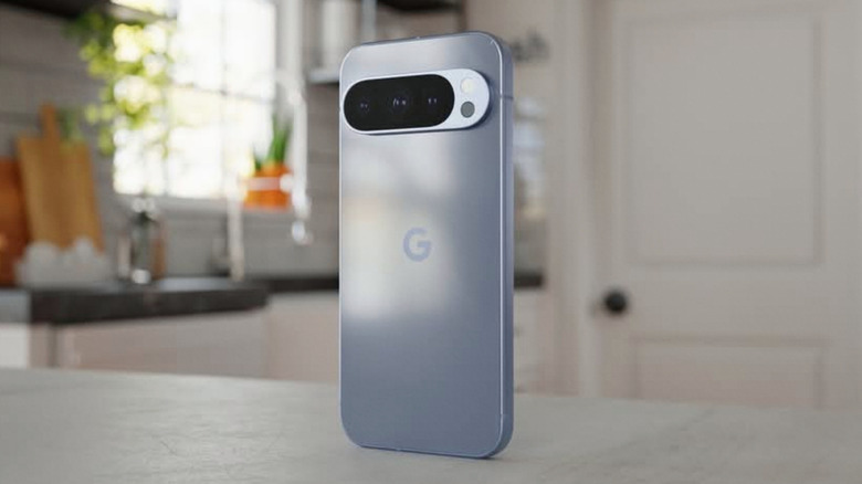 A silver Google Pixel 10 XL standing upright on a kitchen countertop