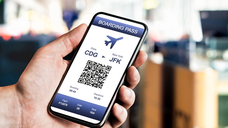 Person looking at digital boarding pass on their phone