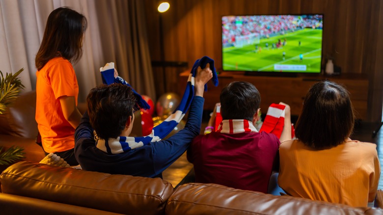a family watching TV in their living room