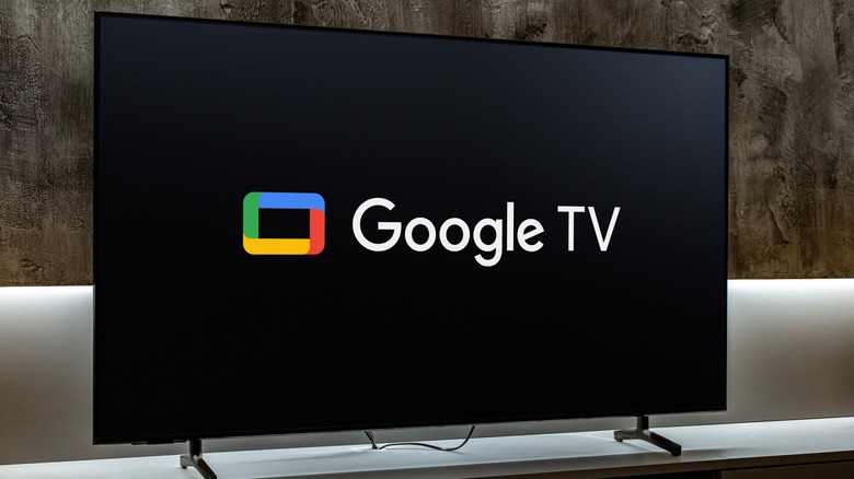 TV placed on a table with the screen showing the Google TV logo.
