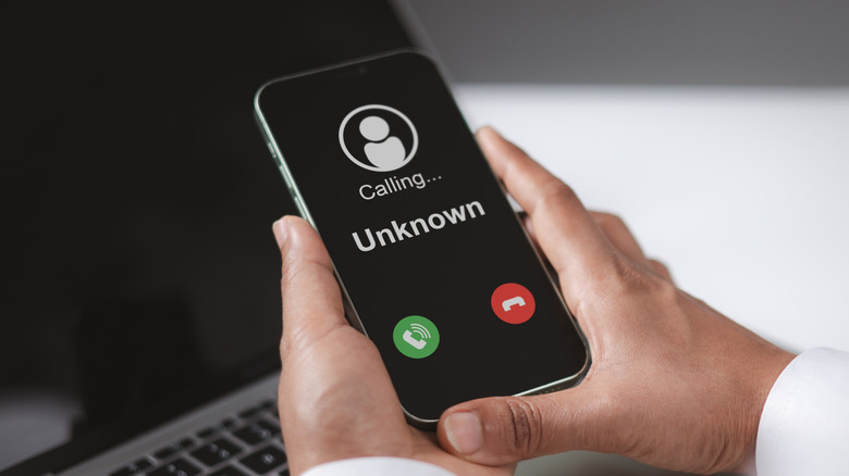 A person receiving a call from an unknown number