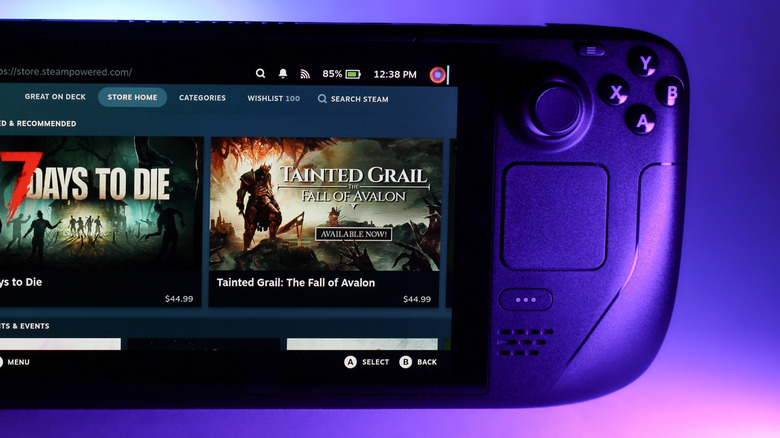 Steam Deck showing Steam store on display on purple background