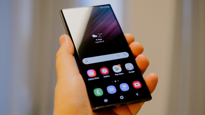 A person holding a Samsung smartphone