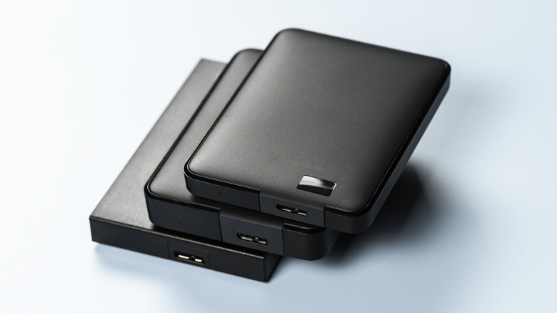 A stack of external storage drives.