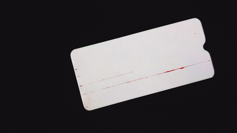 Image of a faulty Android phone display showing a single red glitch line.