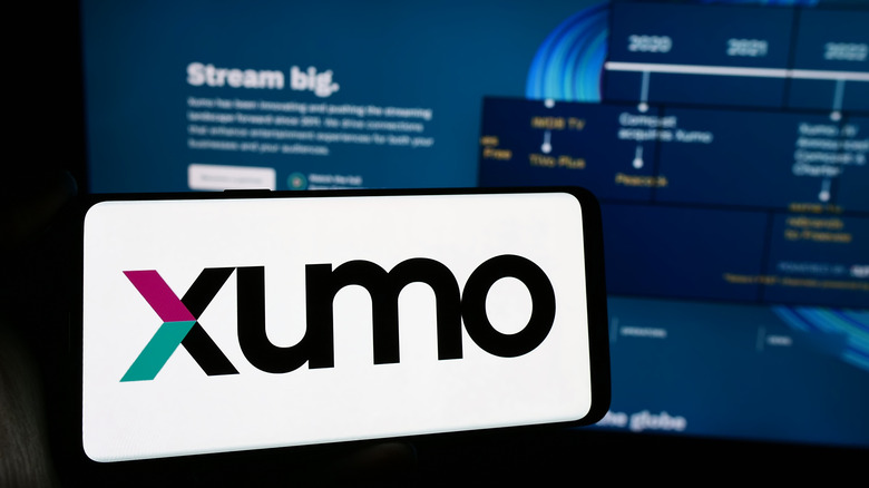 Xumo phone app with TV in the background