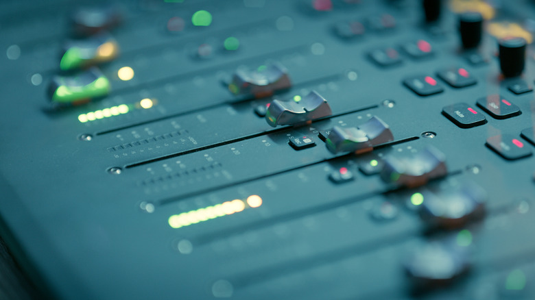 Sound controls on an audio mixing board.