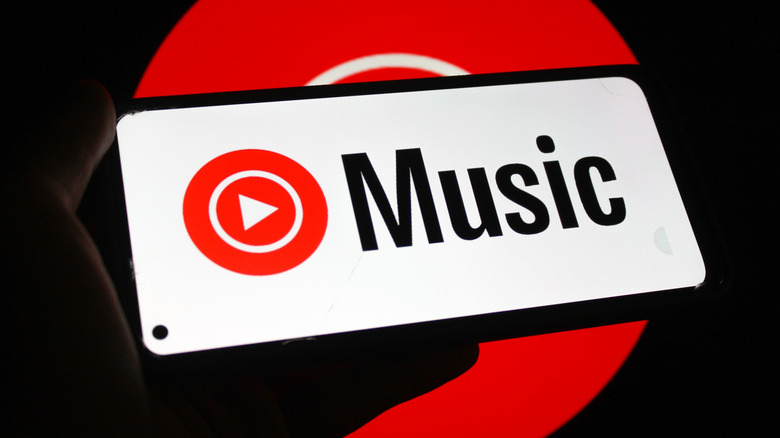 The YouTube Music logo displayed on a smartphone