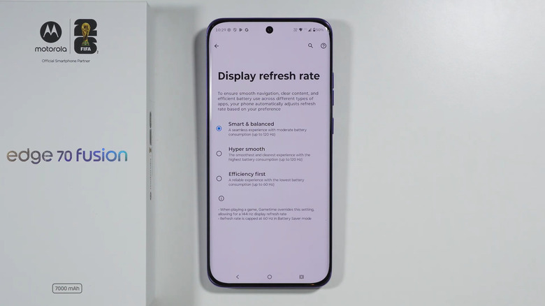 A Motorola Edge 70 Fusion phone on an off-white background showing display refresh rate