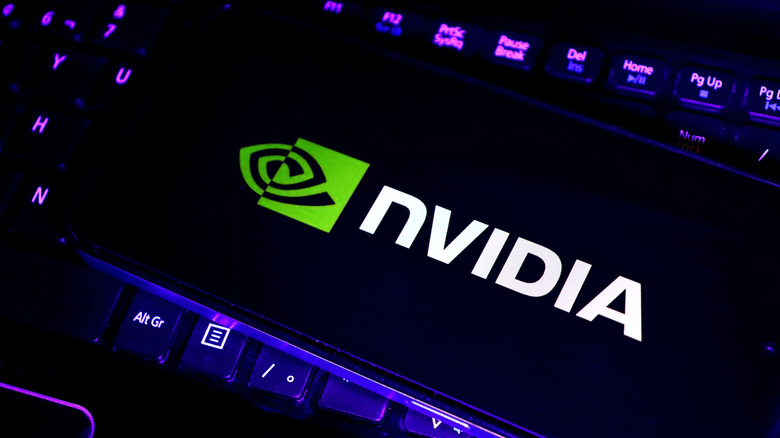 Nvidia logo shown on a phone resting on top of a keyboard.