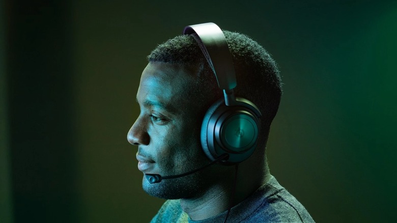 Man wearing black Arctis Nova Pro headset for Xbox
