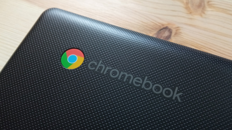 A Chromebook laptop on a wood table
